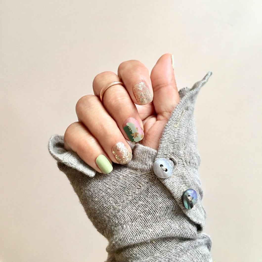 3D nail wrap with gold glitter, mint green and pink colored prints